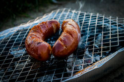 two-sausages-on-charcoal-grill-1275692.j